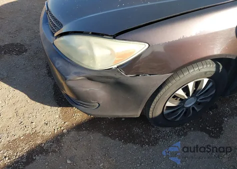 2003 Toyota Camry Le z USA, uszkodzony, nr VIN 4T1BE32KX3U662140